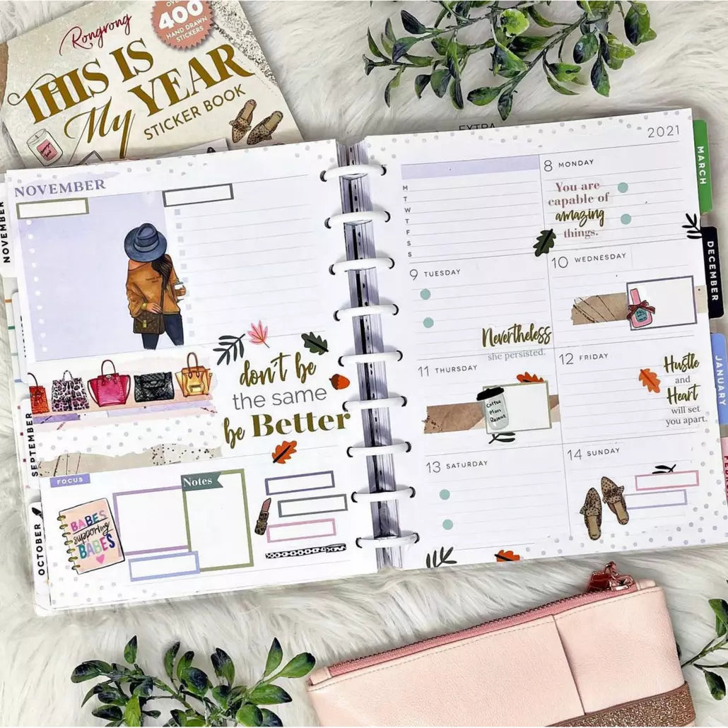 Open planner with stickers and accessories.