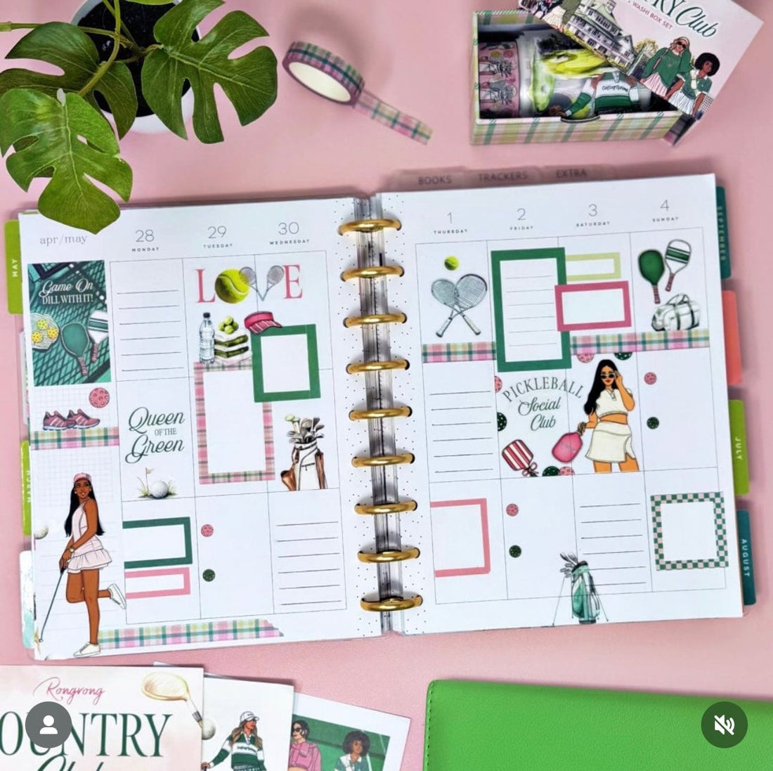 Open planner with golf and tennis stickers.