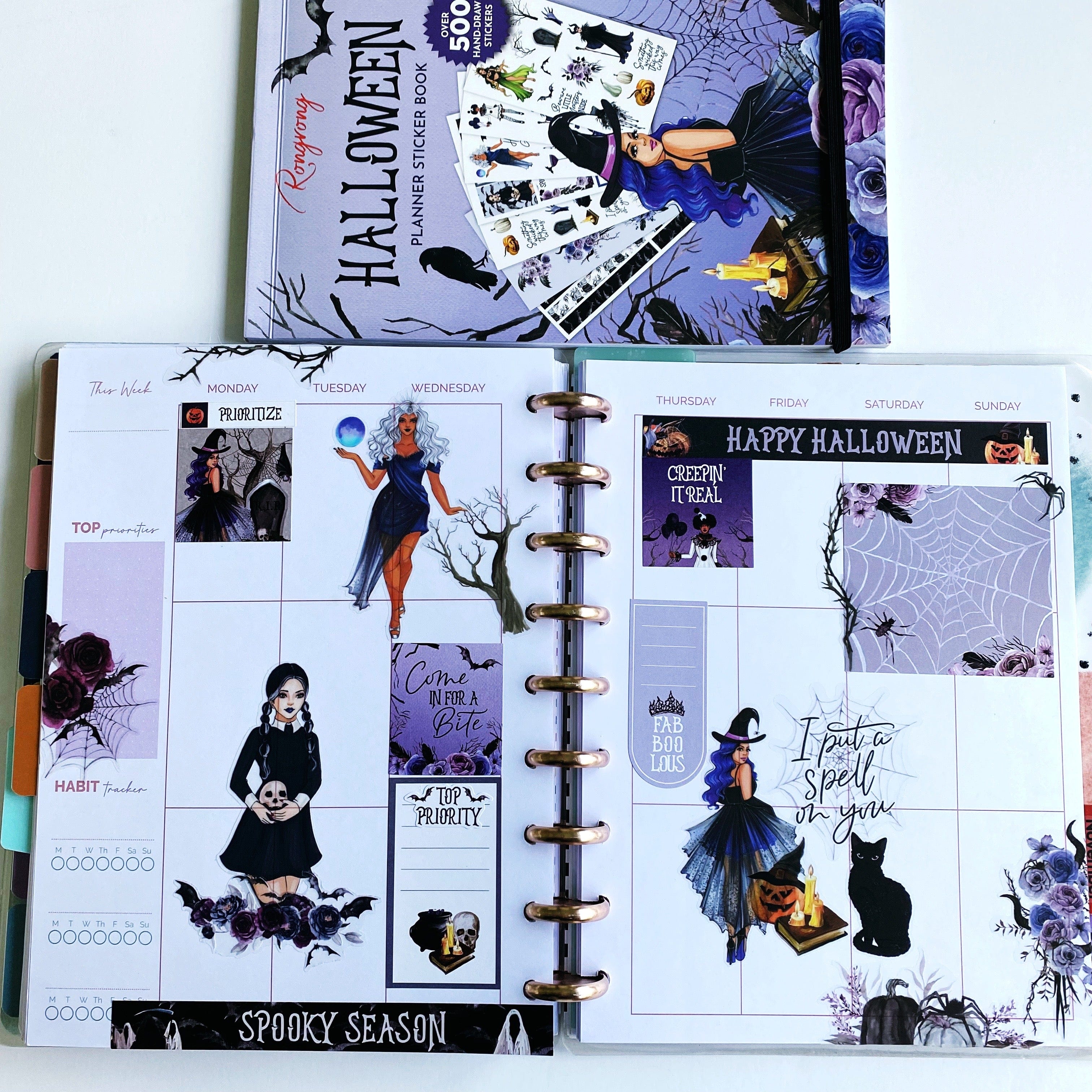 Halloween sticker book spread with planner decorations