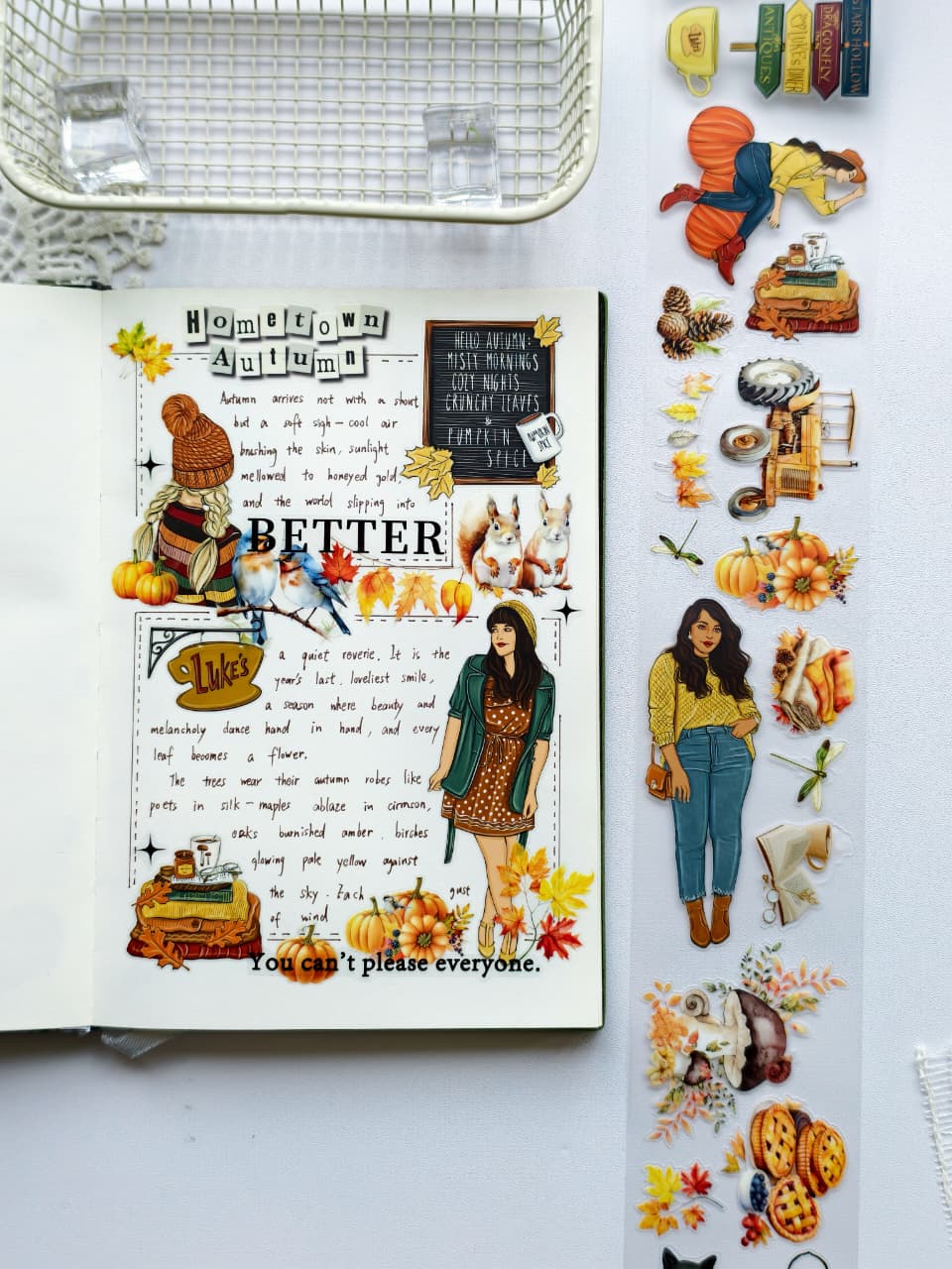 Open journal featuring a cozy autumn-themed layout decorated with Autumn Charm Pre-cut PET Tape [3.0], including pumpkins, fall foliage, woodland animals, stylish autumn girls, and seasonal accents in warm orange and golden tones.