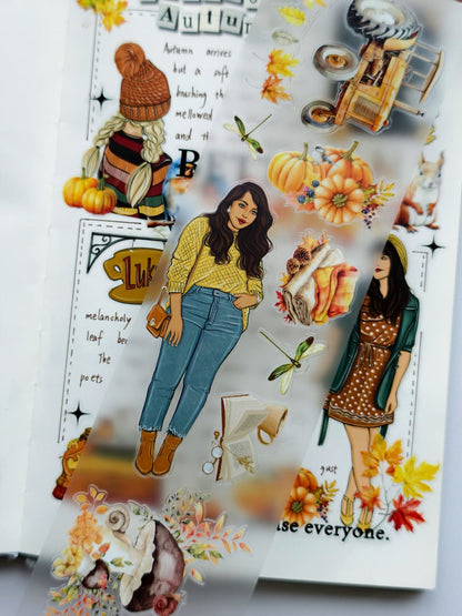 Close-up view of Autumn Charm Pre-cut PET Tape [3.0] showcasing transparent pre-cut stickers with pumpkins, dragonflies, cozy blankets, books, mushrooms, and fashionable autumn-inspired female characters.