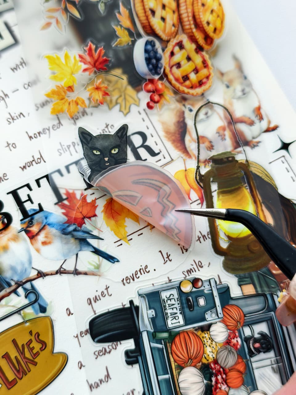 Close-up of Autumn Charm Pre-cut PET Tape [3.0] featuring layered autumn illustrations including pies, lanterns, colorful maple leaves, birds, black cats, squirrels, pumpkins, and vintage harvest-themed artwork.