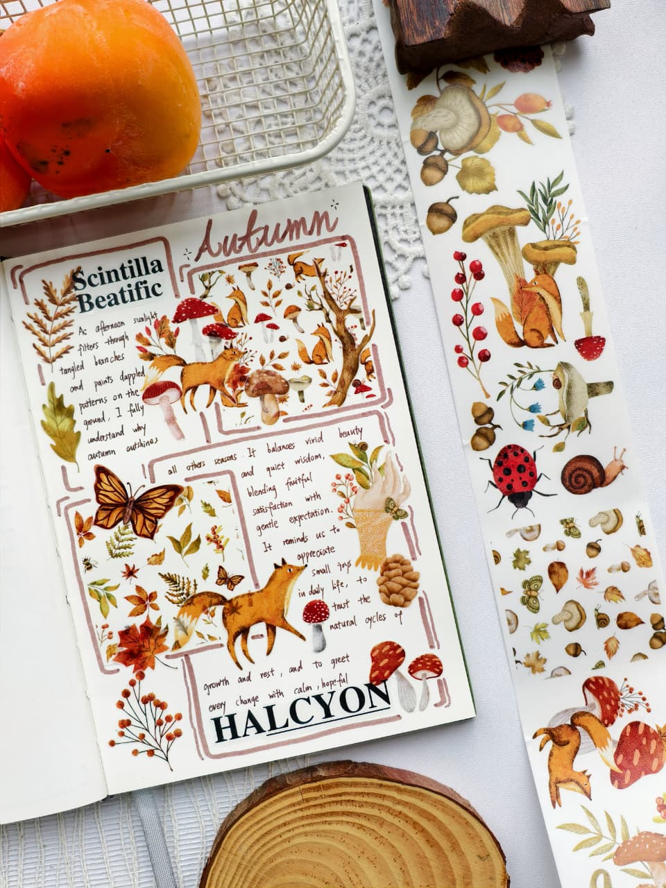 Angled view of a fall-inspired journal layout using Sweet Fall Washi Tape with woodland animals, mushrooms, butterflies, autumn leaves, and nature-inspired watercolor artwork for a cozy seasonal aesthetic.