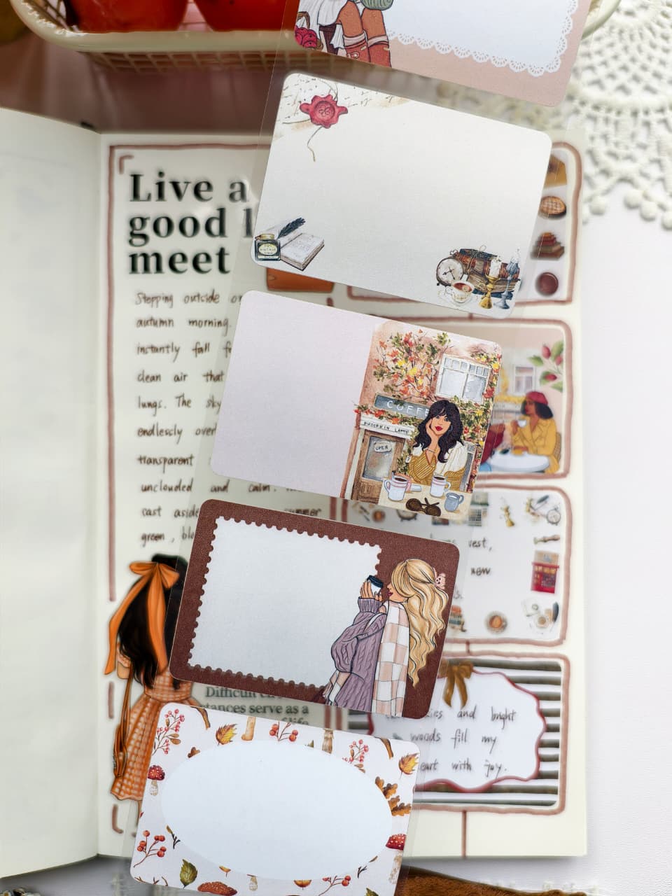 Close-up of Autumn Memos Sticky Notes showcasing writable memo cards with cozy autumn illustrations including readers, coffee shops, books, mushrooms, pumpkins, and warm seasonal foliage.