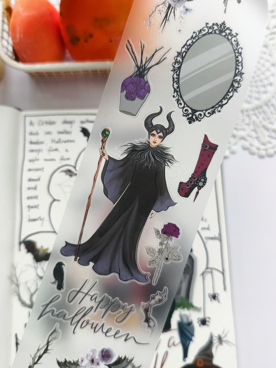 Close-up of Chic Halloween PET Tape featuring a dark fairy-inspired character, ornate mirror, purple roses, raven, "Happy Halloween" lettering, gothic boot, and elegant Halloween decorative elements.