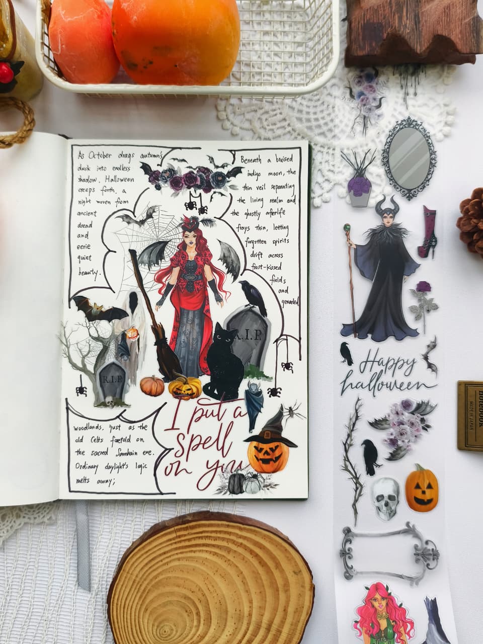 Open journal featuring a gothic Halloween scrapbook spread decorated with Chic Halloween PET Tape, showcasing a dramatic witch, black cat, ravens, pumpkins, gravestones, bats, and elegant spooky accents.