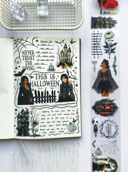 Flat lay of a Halloween-themed journal featuring Creepy Hollow pre-cut PET tape with haunted mansion stickers, gothic illustrations, spooky quotes, pumpkins, bats, and transparent decorative elements.