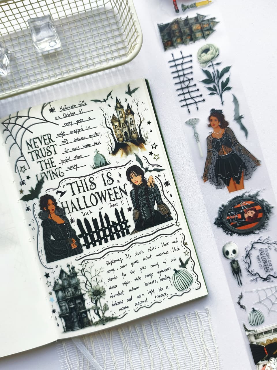Planner spread decorated with Creepy Hollow pre-cut PET tape featuring haunted houses, gothic girls, Halloween typography, bats, pumpkins, and vintage spooky journal embellishments.