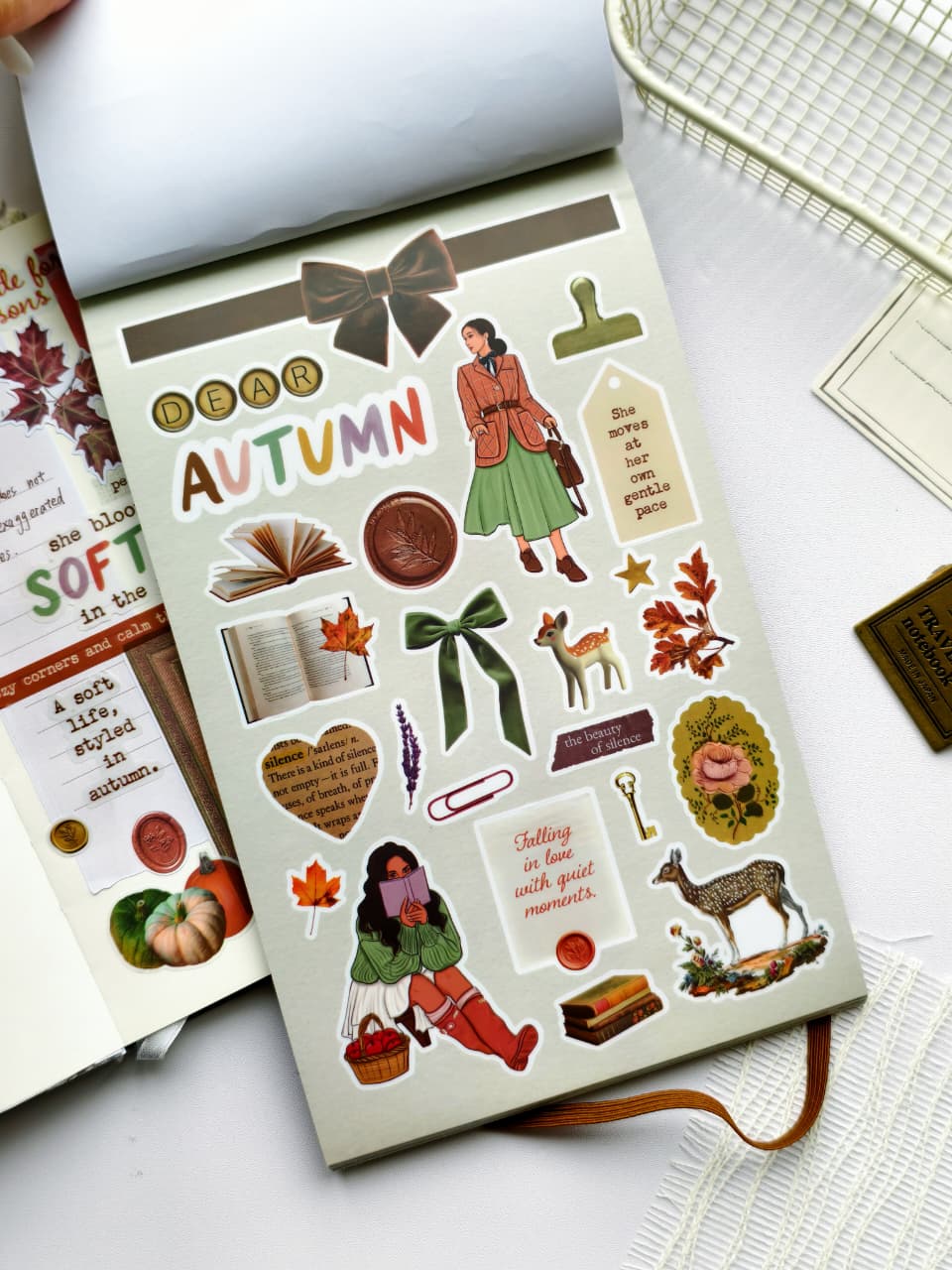 Sticker sheet featuring books, bows, deer, autumn leaves, reading-themed illustrations, vintage labels, floral accents, and cozy fall quotes from the Dear Autumn Sticker Book.