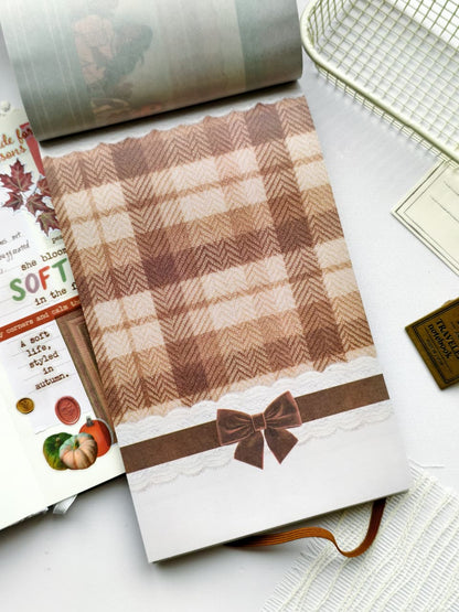 Full-page plaid sticker from the Dear Autumn Sticker Book featuring warm brown tones, lace trim, and a decorative velvet-style bow for layering in journals and scrapbooks.