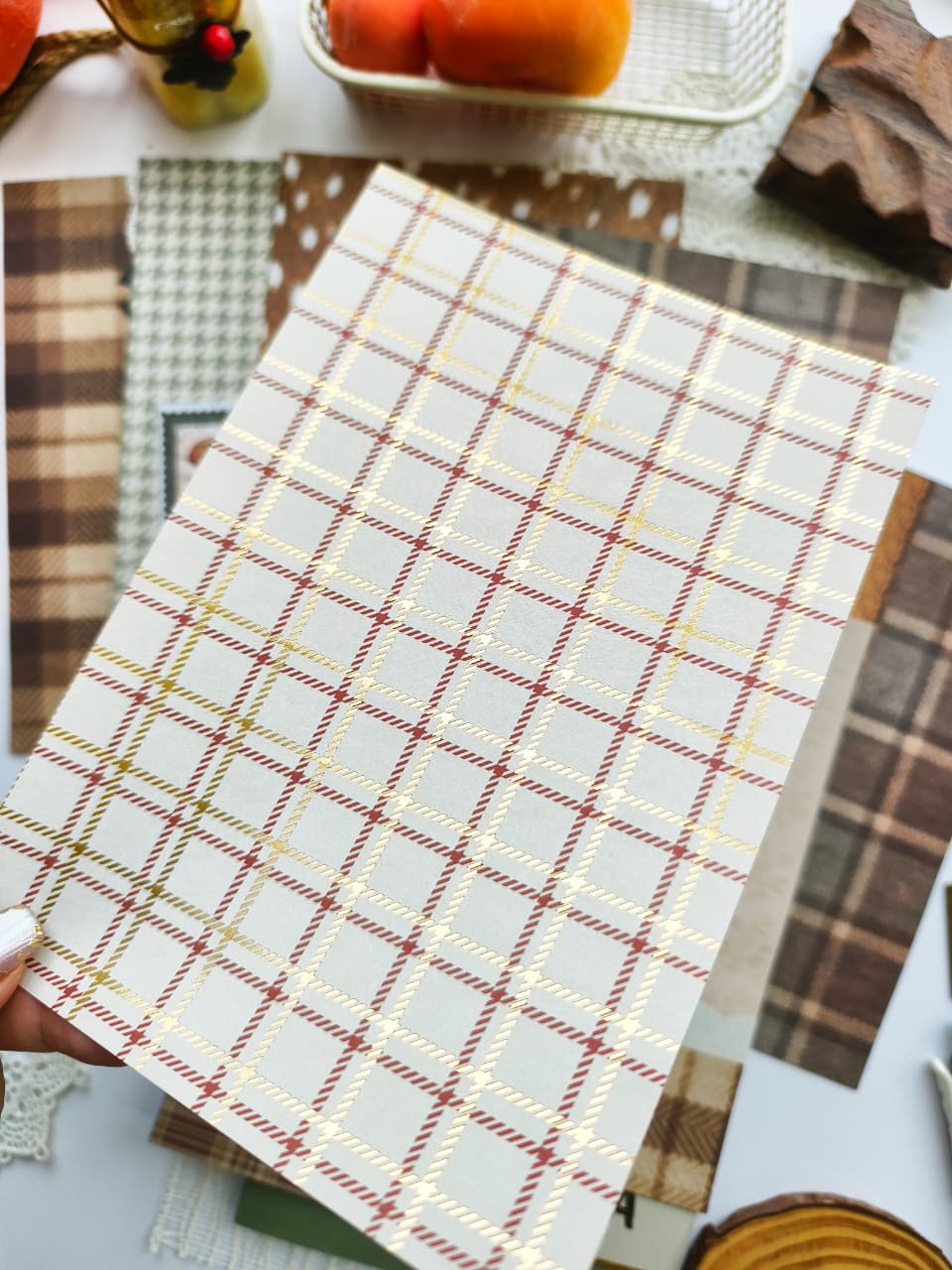 Cream-colored scrapbook paper featuring a classic plaid pattern accented with gold foil from the Dear Autumn collection for autumn journaling, card making, and memory keeping.