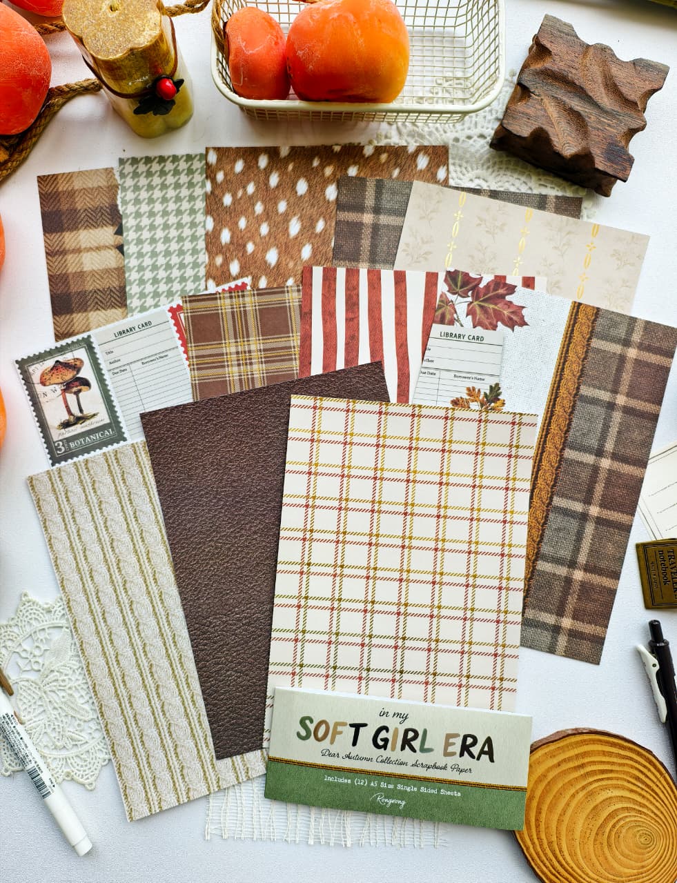 Full Dear Autumn scrapbook paper set displayed with cozy plaid, deer-inspired prints, knit textures, botanical backgrounds, and autumn-themed crafting papers.