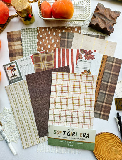 Full Dear Autumn scrapbook paper set displayed with cozy plaid, deer-inspired prints, knit textures, botanical backgrounds, and autumn-themed crafting papers.