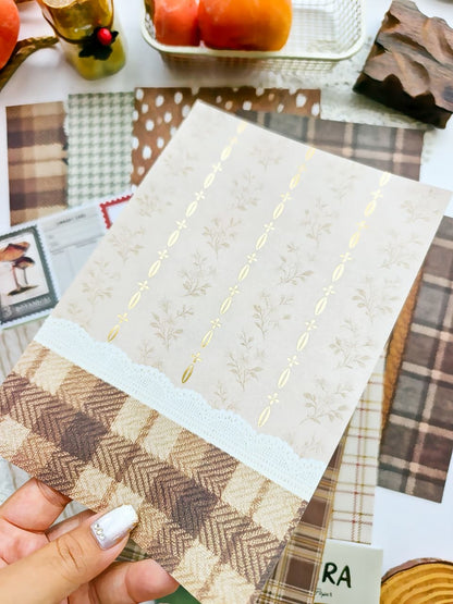 Neutral floral scrapbook paper with delicate botanical illustrations, gold foil accents, lace trim, and cozy plaid details from the Dear Autumn collection.
