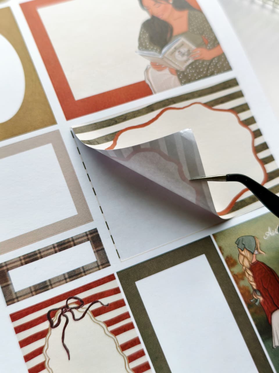 Close-up of a journaling label being peeled from the Dear Autumn Sticker Book, highlighting the smooth premium paper material and easy peel-and-stick adhesive.