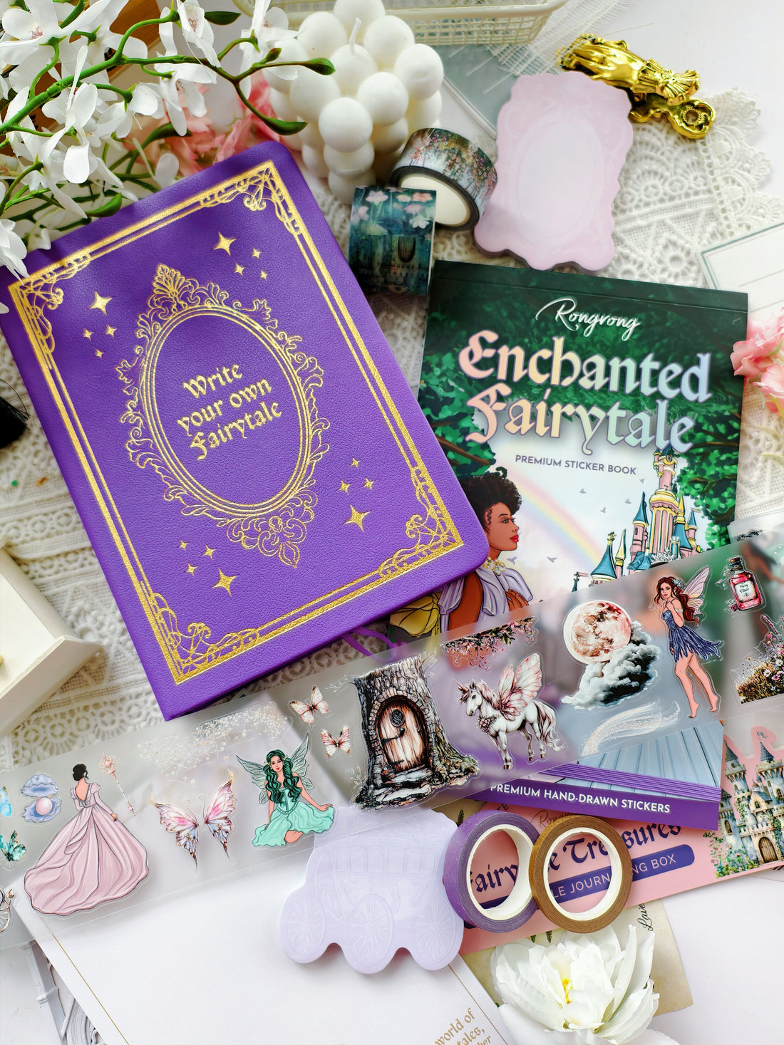 Enchanted Fairytale journal box flatlay featuring purple journal, premium sticker book, washi tapes, transparent stickers, and magical fantasy stationery accessories.