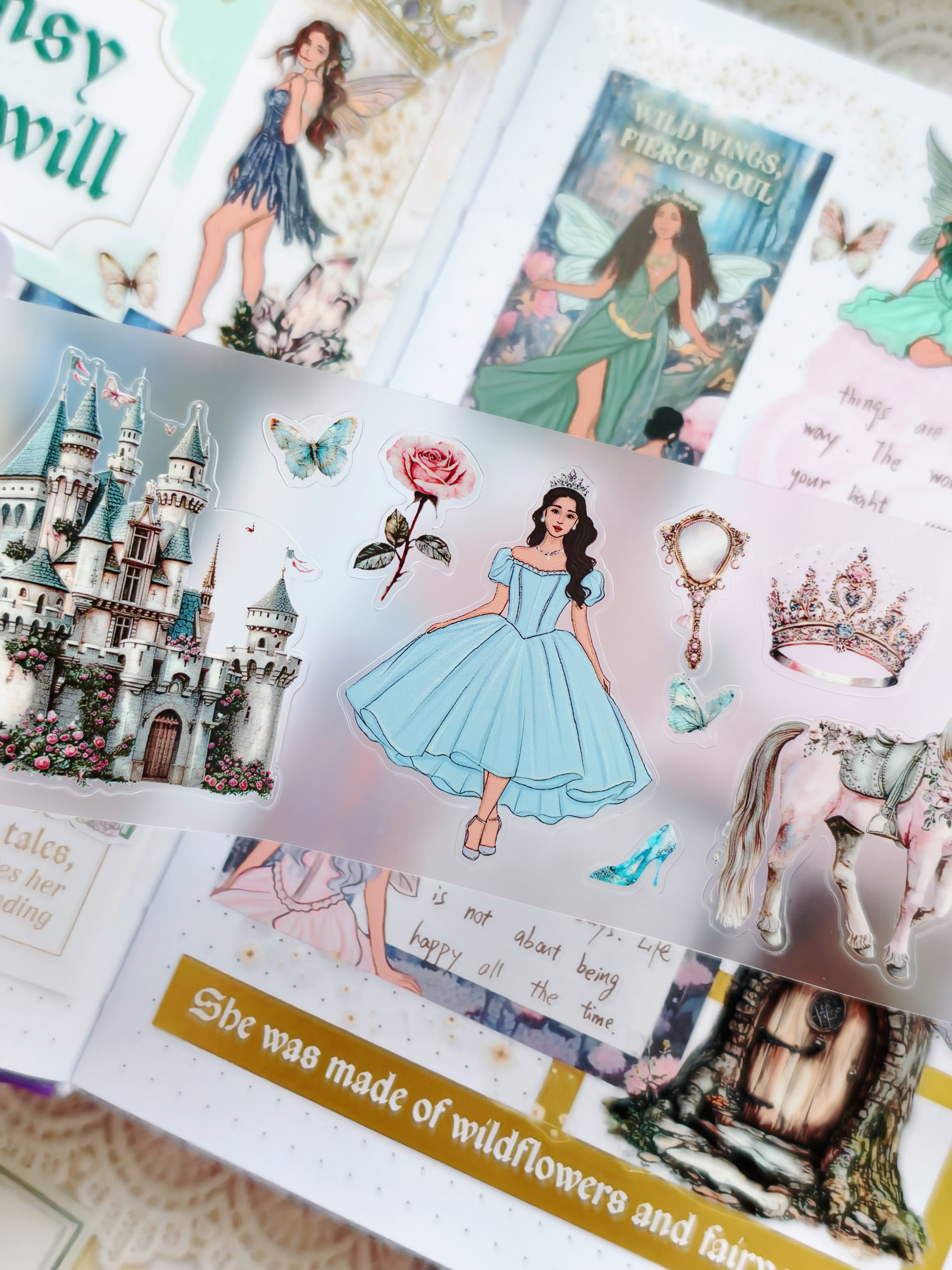 Close-up of Enchanted Fairytale transparent stickers featuring castle, princess, butterflies, crown, mirror, unicorn, and magical fantasy illustrations.