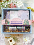 Collectible journaling box with decorative items and &