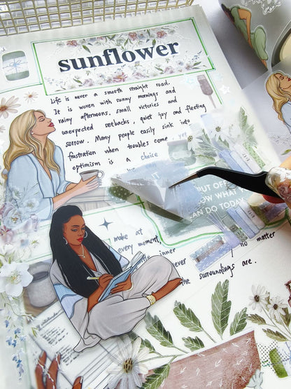 Macro view of Gentle Focus pre-cut PET tape with tweezers peeling a transparent sticker featuring calming floral arrangements, books, mindful quotes, and relaxing lifestyle illustrations.