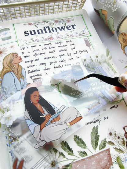 Close-up of Gentle Focus pre-cut PET tape showing an easy-to-peel transparent sticker featuring peaceful journaling illustrations, floral elements, books, and mindful lifestyle designs.