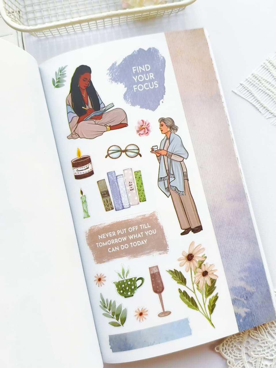 Sheet of stickers with illustrations and motivational phrases on a white surface.