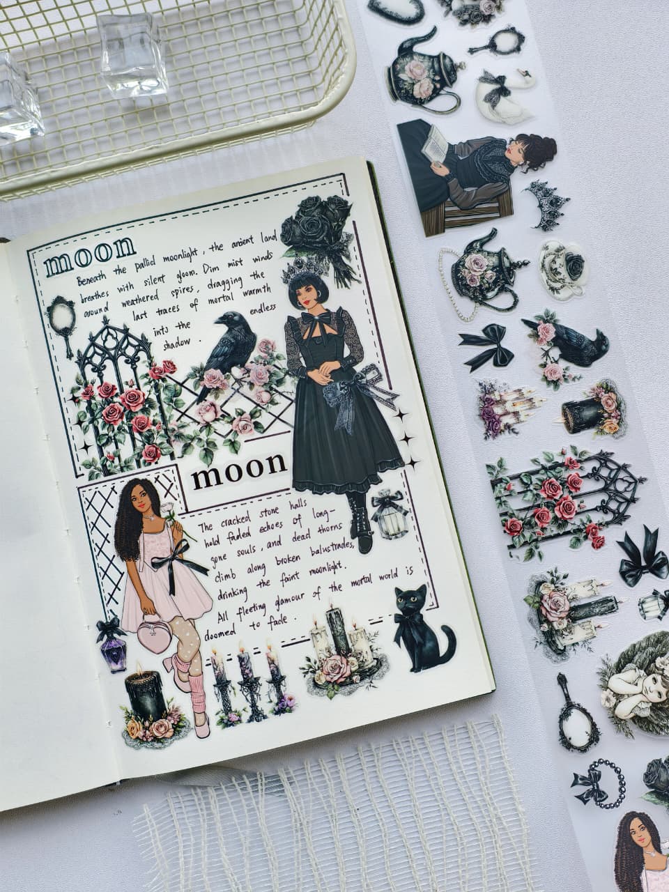 Journal spread decorated with Gothic Coquette pre-cut PET tape featuring gothic girls, ravens, roses, black cats, candles, ornate gates, and romantic vintage elements.