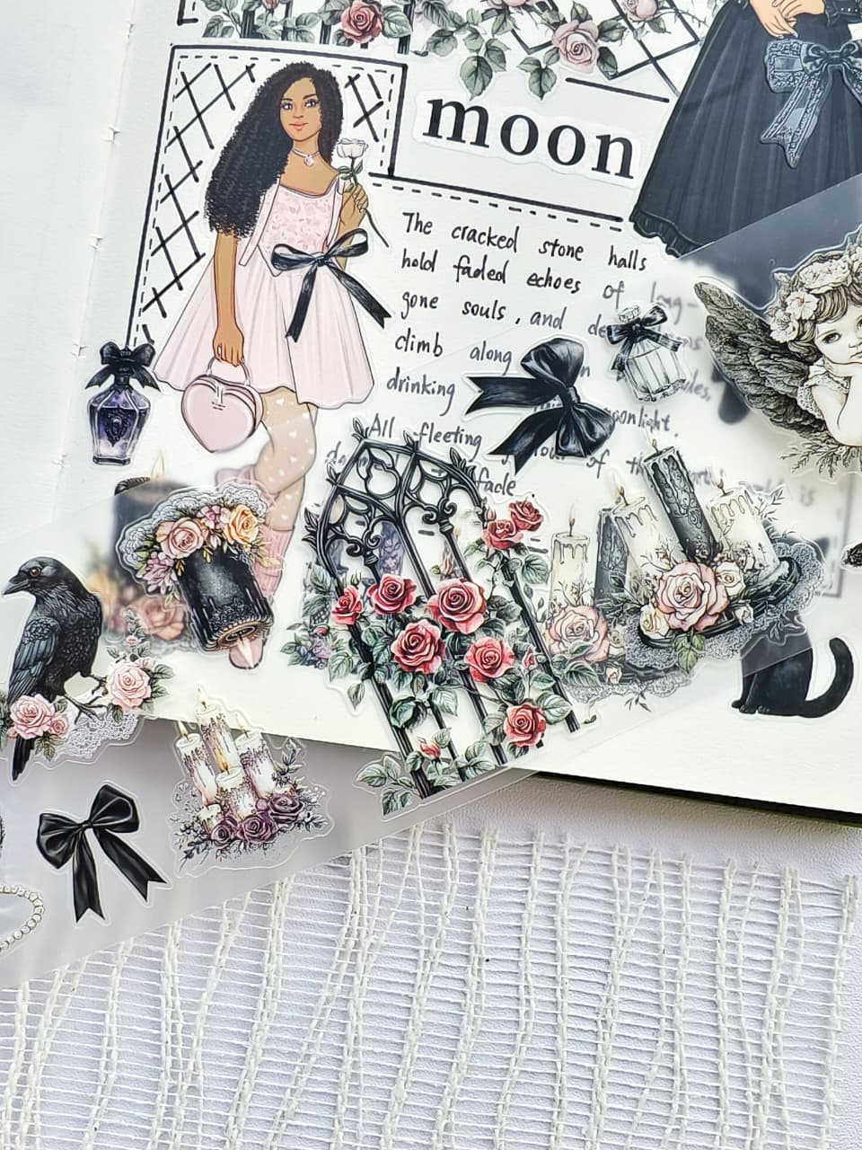 Close-up of Gothic Coquette pre-cut PET tape featuring gothic floral gates, black bows, candles, ravens, roses, angels, and elegant fashion girl stickers on transparent PET material.