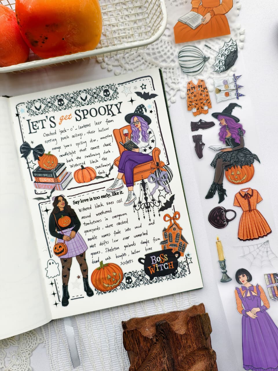 Angled view of a Halloween-themed journal spread created with Happy Haunts PET Tape, showcasing whimsical witches, pumpkins, haunted houses, gothic borders, and cozy autumn details.