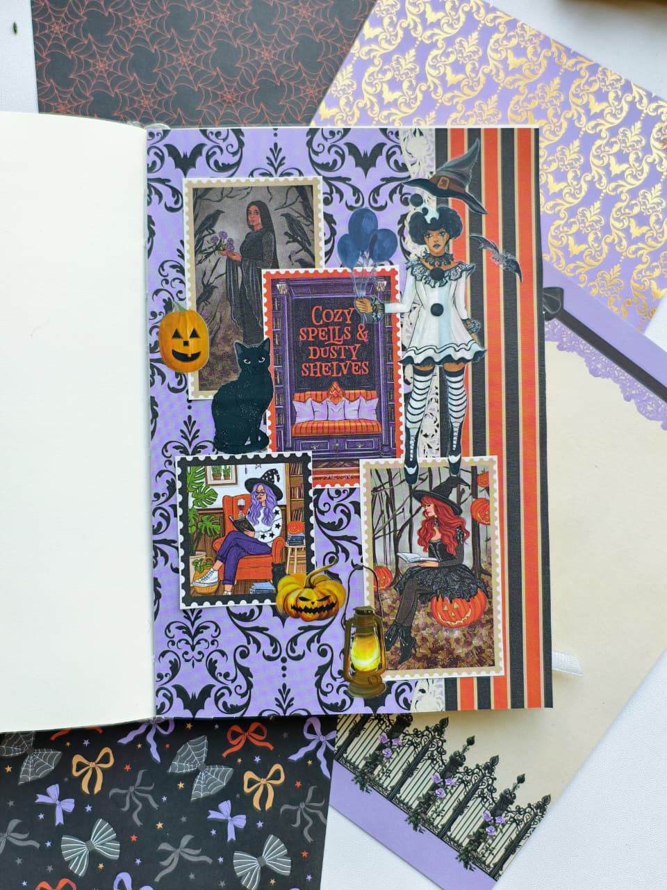 A handmade Halloween scrapbook page featuring a purple damask background, vintage-style illustrations of a witch, skeleton, black cat, and pumpkins, alongside a central sign reading &