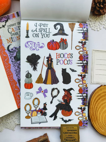 Close-up of a Halloween decorative sticker page with witches, black cats, pumpkins, gothic flourishes, Halloween quotes, broomsticks, and spooky book-themed embellishments.