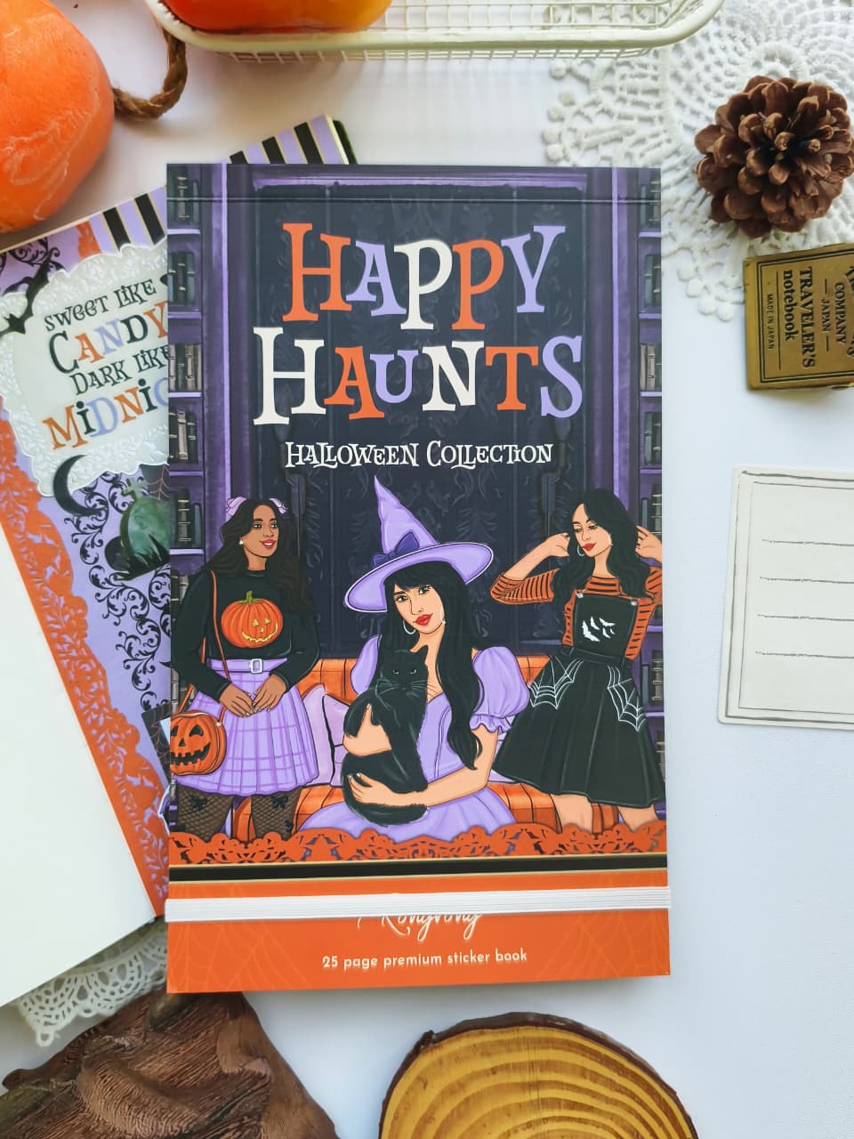 Front cover of the Happy Haunts Sticker Book featuring three stylish Halloween characters, a black cat, pumpkins, and a cozy haunted library background in purple and orange tones.
