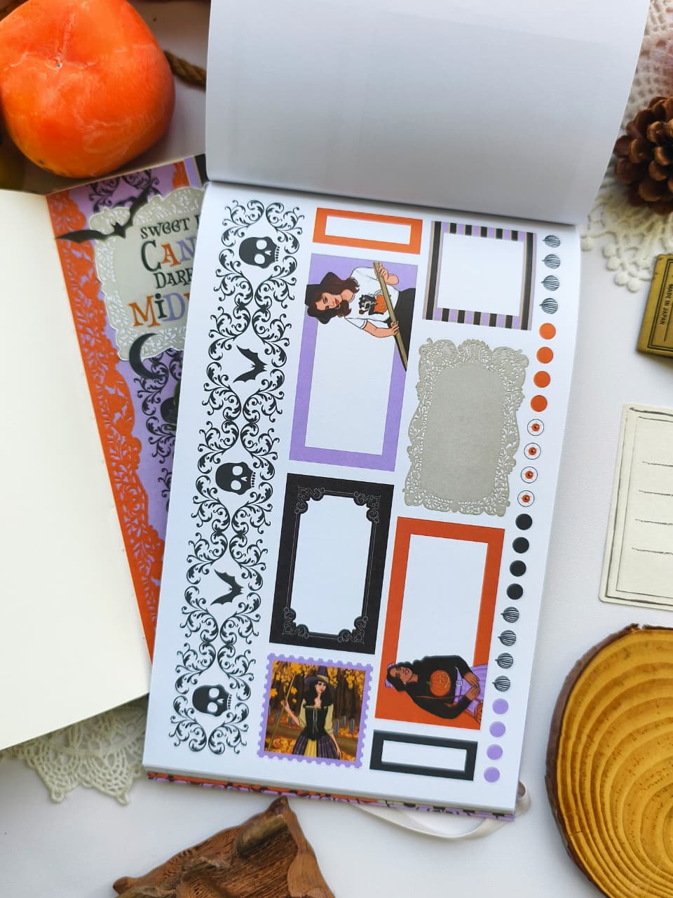 Halloween planner sticker page featuring decorative boxes, gothic borders, checklist dots, labels, ornate frames, and spooky-themed planner accessories in orange, purple, and black.