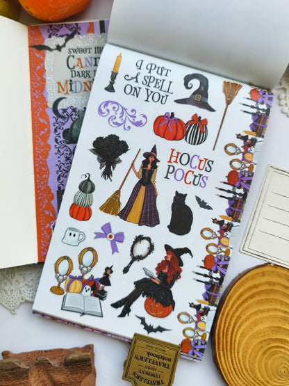 Halloween sticker page featuring witches, black cats, pumpkins, broomsticks, spell books, mirrors, candles, bows, and spooky decorative accents for planners and journals.
