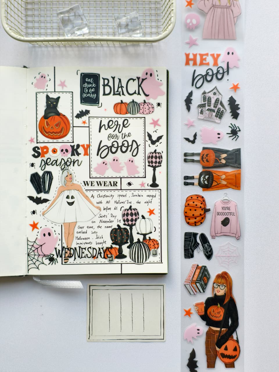 Journal spread decorated with Hey Boo Pre-cut PET Tape featuring pastel pink ghosts, pumpkins, bats, black cats, spooky typography, and playful Halloween-themed illustrations in pink, black, and orange tones.