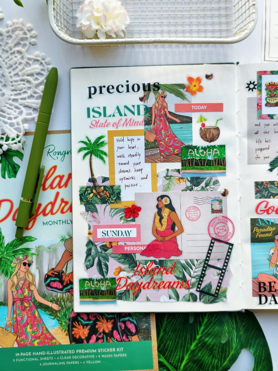 Creative journal layout using the Island Daydreams Monthly Planning Kit featuring tropical leaves, floral accents, Hawaiian-inspired stickers, beach postcards, and colorful layered ephemera in a vacation-themed planner spread.