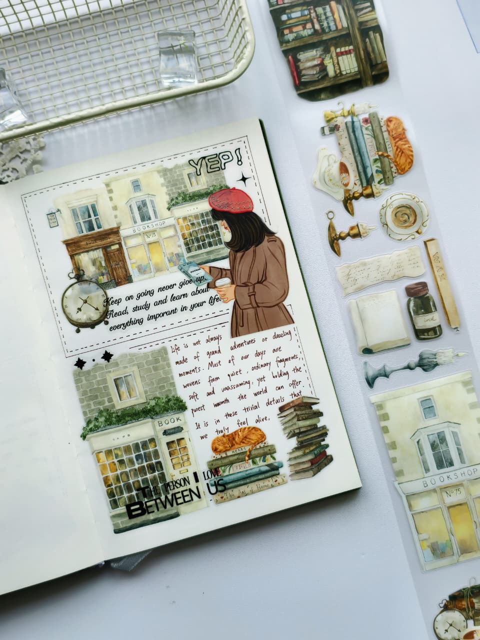Creative journal spread using Magic Library Pre-cut PET Tape with watercolor-style bookshops, vintage books, reading-themed illustrations, and cozy bookstore-inspired accents arranged around handwritten journaling.
