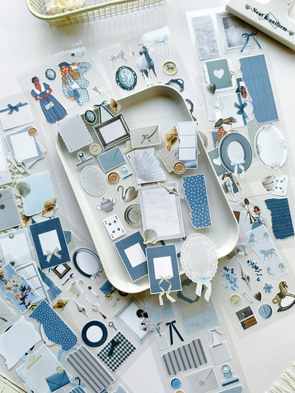 Collection of decorative stickers with blue and white design on a white surface