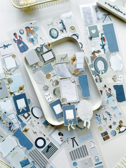 Collection of decorative stickers with blue and white design on a white surface