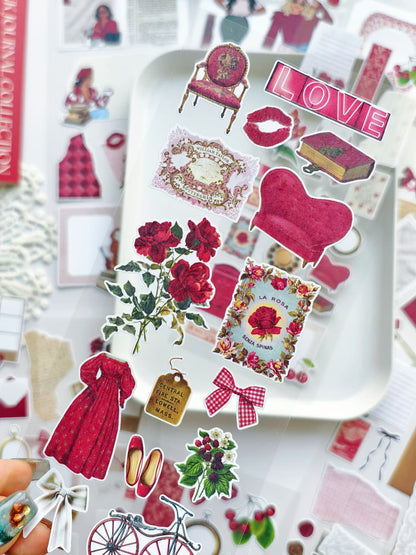 Collection of decorative stickers on a white tray with &