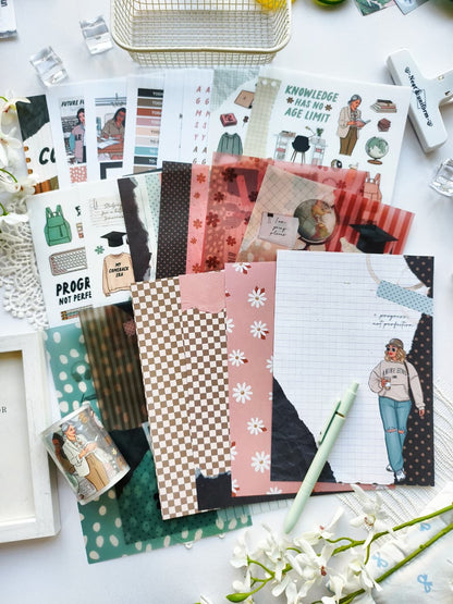 Flat lay of the My Comeback Era collection featuring journaling papers, PET tape, sticker sheets, motivational quotes, career-themed illustrations, office accessories, and soft pink, sage green, and neutral color palettes.