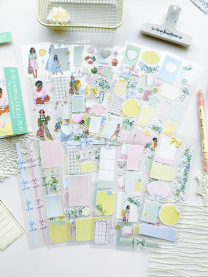 Full set of pastel ephemera stickers featuring bows, florals, pastel memo papers, envelopes, hearts, and illustrated girls arranged on a white desk.