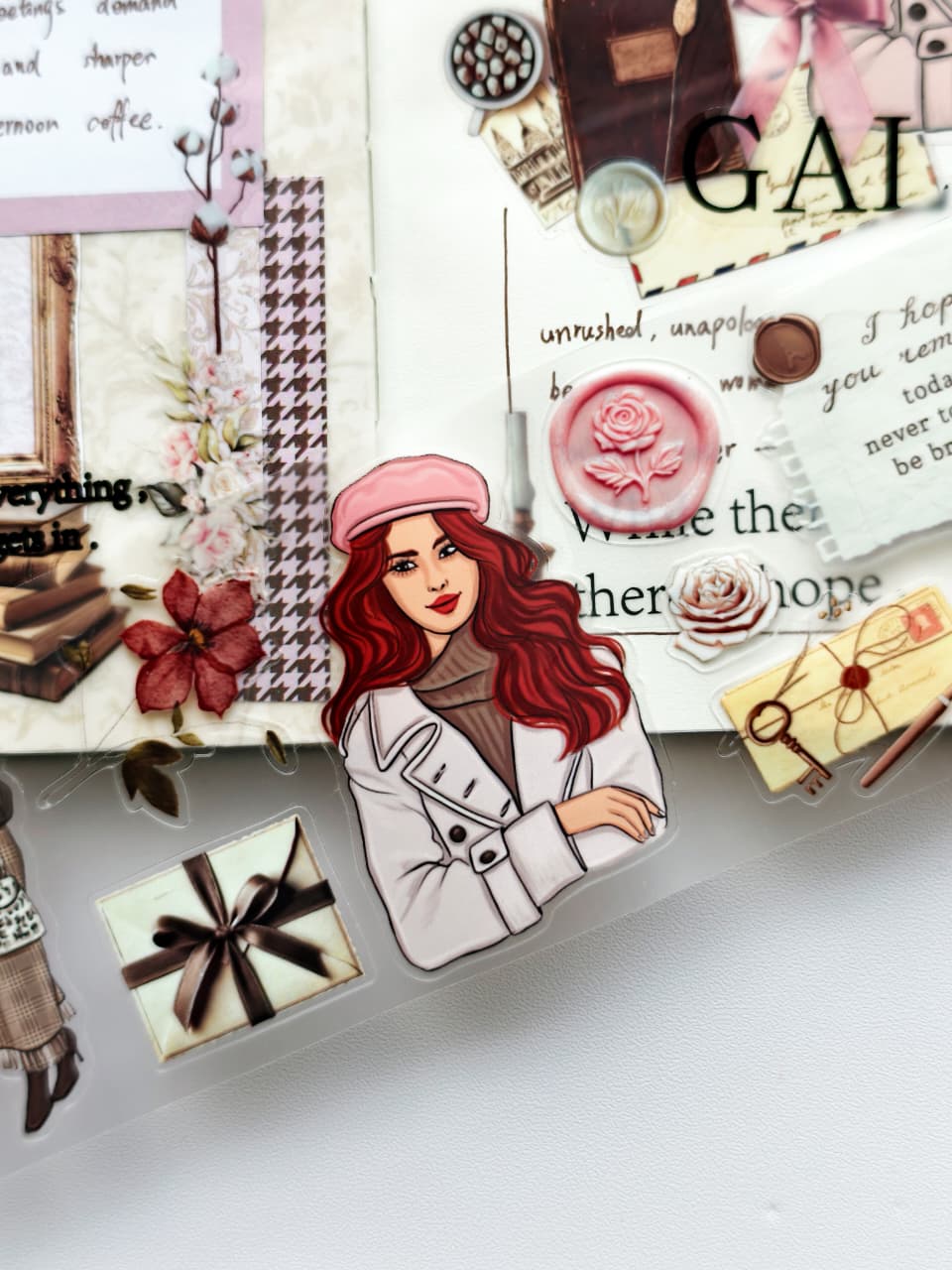 Close-up of PET tape featuring a red-haired woman in a pink beret and cream trench coat surrounded by vintage envelopes, wax seals, floral accents, handwritten letters, and Parisian-inspired ephemera.