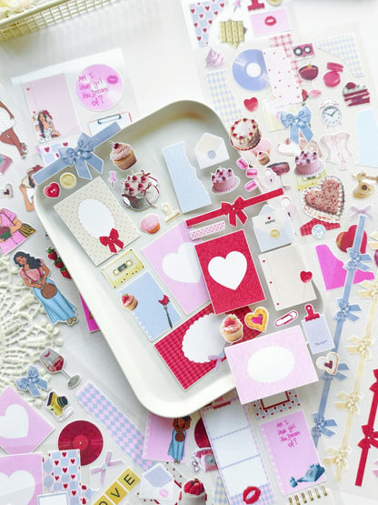 Collection of decorative stickers with hearts, bows, and other designs on a white surface.