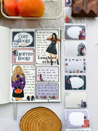 Open journal featuring a cozy Halloween-themed scrapbook spread with decorative stickers and journaling, displayed beside a collection of Wicked Little Notes sticky notes with gothic-inspired illustrations and writable labels.