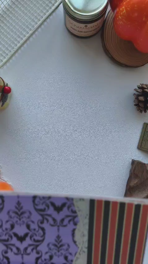 Unboxing video showcasing the Happy Haunts Scrapbooking Paper collection with gold foil Halloween patterns, spooky chic designs, black cats, pumpkins, bows, and elegant purple papers perfect for junk journals, scrapbooks, planners, and fall crafting.