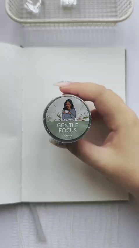 Plan With Me video showcasing Gentle Focus pre-cut PET tape in a calming journal spread featuring transparent floral stickers, self-care illustrations, books, candles, botanical accents, and inspirational wellness quotes for planners and journals.