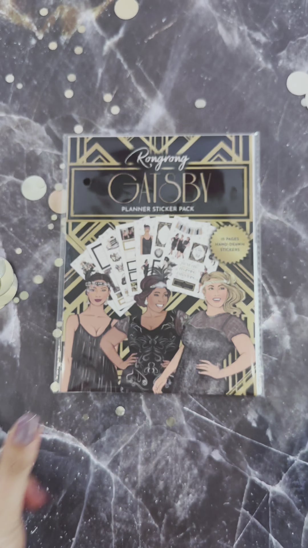 Video showcasing the Gatsby Planner Sticker Pack, flipping through pages filled with stylish gold foil stickers.